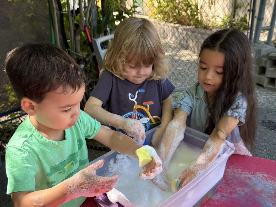 Children enjoying summer water play at ECLA