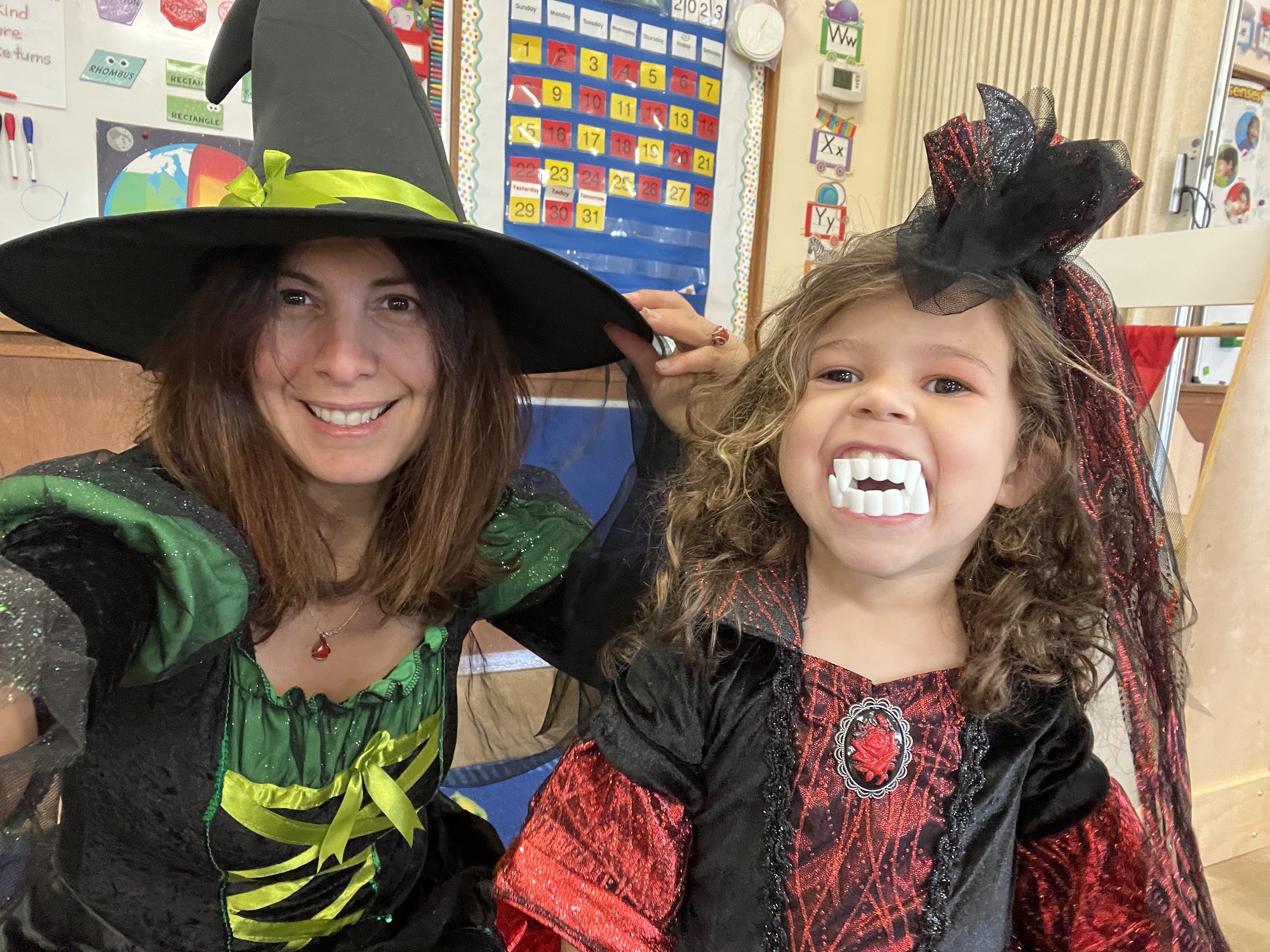 ECLA's director and a student in Halloween costumes