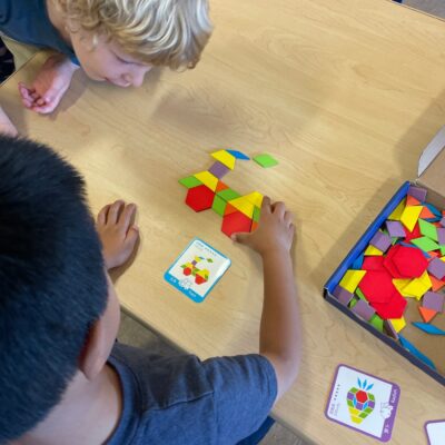 Children solving pattern block puzzles
