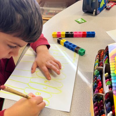 A child drawing with crayons