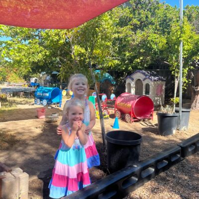 Children balancing along the playground border